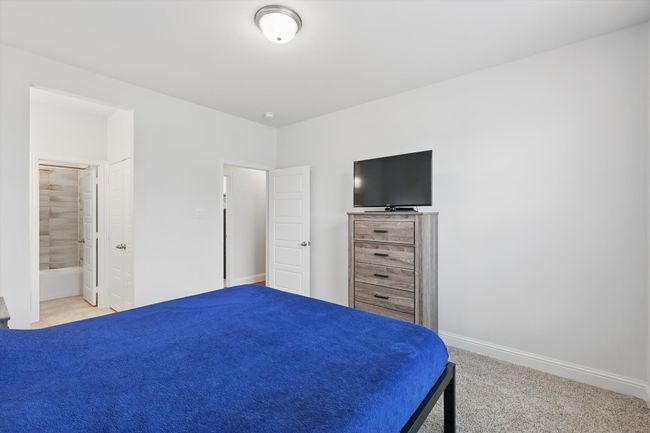 2nd bedroom downstairs with en suite bath | Image 25