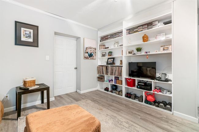 Second family room featuring built-in shelving. | Image 32