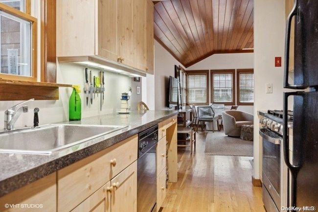main kitchen view to livng room | Image 12