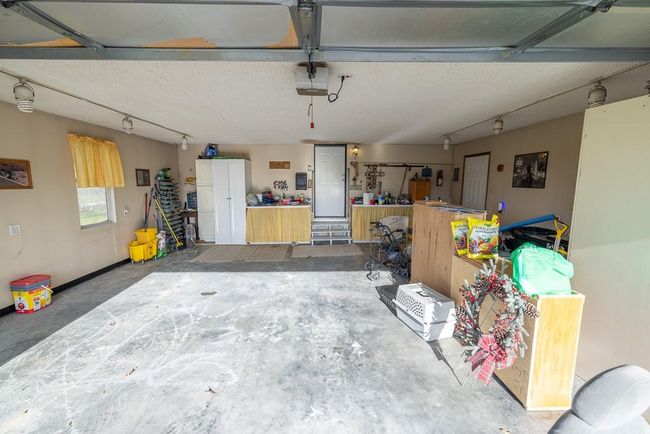 Garage with a garage door opener | Image 29