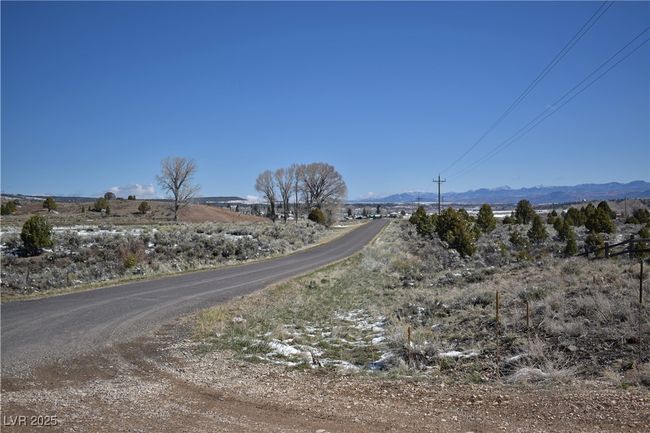 View of asphalt street with a mountain view | Image 4