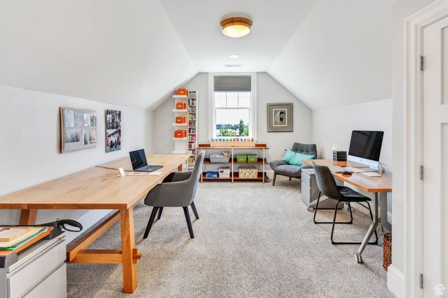 Carpeted office with lofted ceiling | Image 43