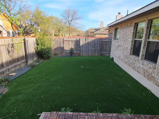 View of fenced backyard | Image 33