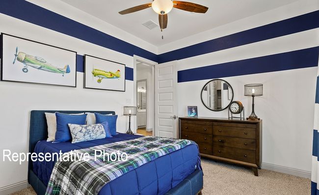 Carpeted bedroom featuring a ceiling fan | Image 11