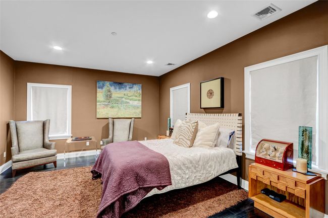 Bedroom with dark wood finished floors, baseboards, and recessed lighting | Image 18