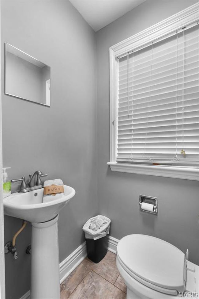 Half bathroom with baseboards and toilet | Image 12