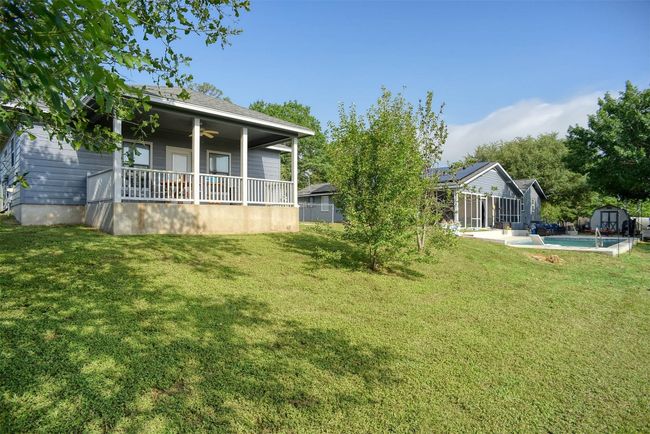 The guest house back porch, located next to the main house | Image 29