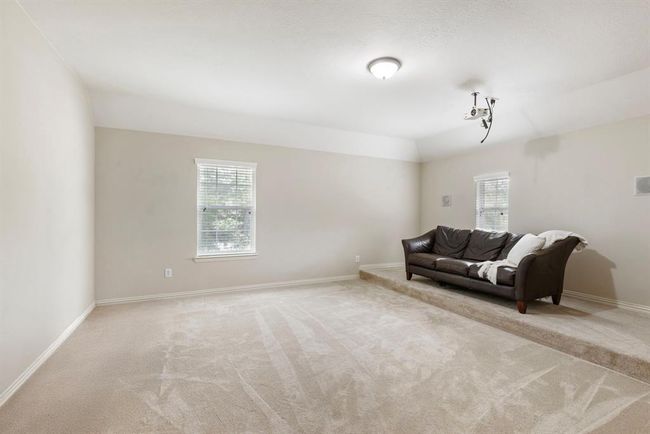 1 of 3 bedrooms on 2nd floor. Currently has a riser and is being used as media room. | Image 32