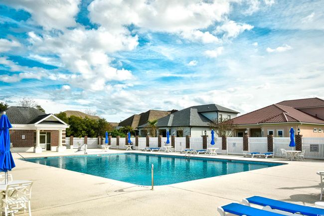 Community pool with a patio | Image 6