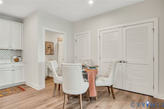Dining space with light wood finished floors and recessed lighting | Image 9