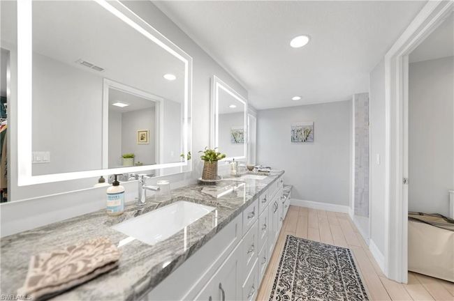 Bathroom with hardwood / wood-style floors and vanity | Image 23