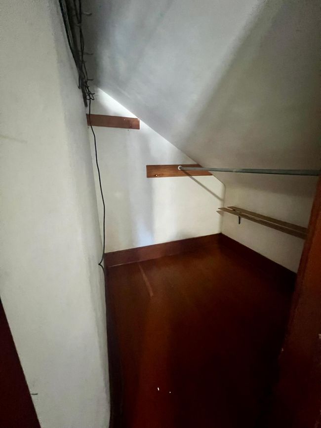 Walk in closet in first bedroom | Image 15