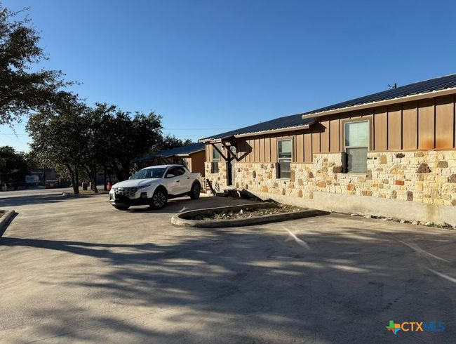 Each apartment has own entrance and back patio. Another view of apartment community. | Image 16