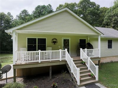 View of front facade with a front yard and a porch | Image 3