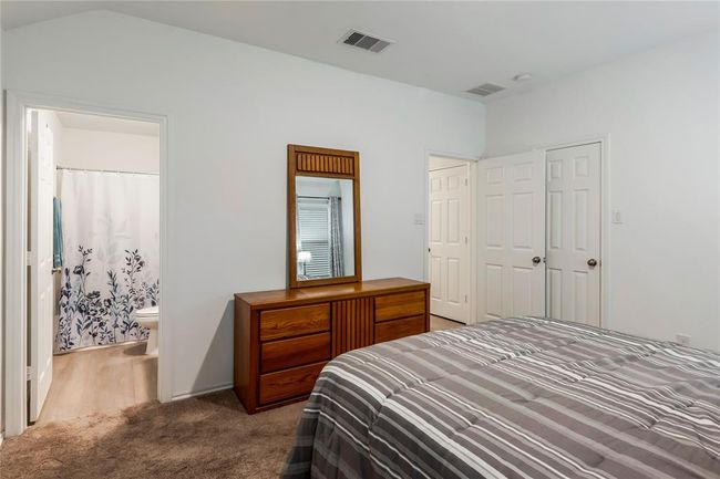 Third angle of the master bedroom, showing off natural light and cozy corners. | Image 13
