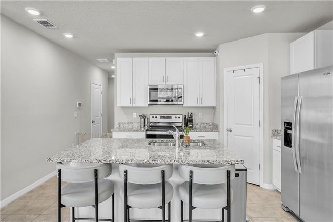 Kitchen island with counter height eating area | Image 7