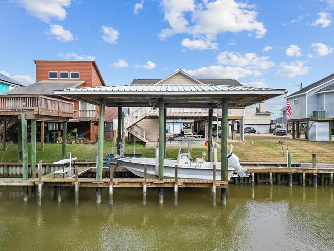 A look at the back of the house, boat house and lift. Catch your fish and clean them right outside! | Image 28