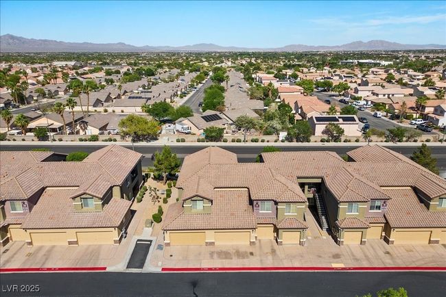 Aerial view of residential area featuring a mountain backdrop | Image 44
