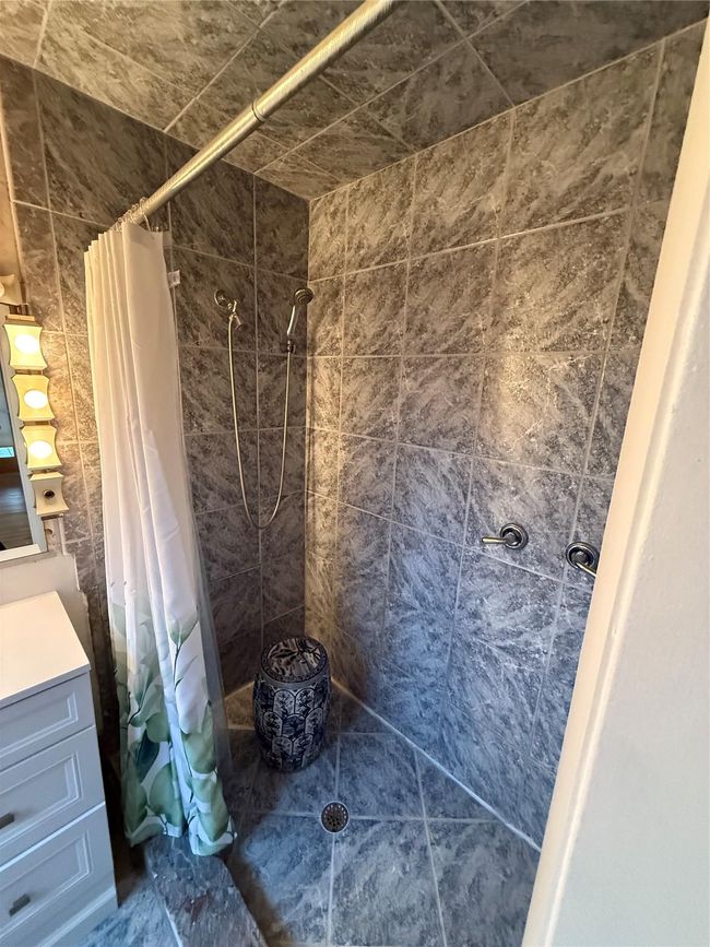 Full bath with tiled shower and vanity | Image 14