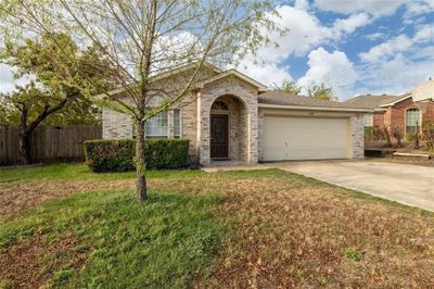 Single story home with a front yard and a garage | Image 3