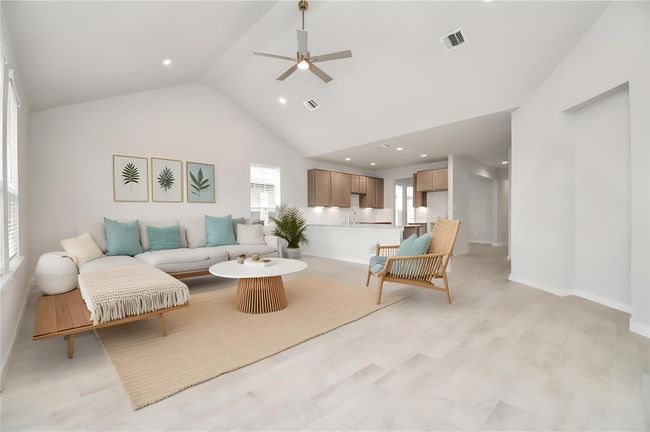 *Virtually Staged* Gather the family and guests together in your lovely living room! Featuring soaring high ceilings, recessed lighting, ceiling fan, custom paint, gorgeous floors, and large windows that provide plenty of natural lighting throughout the day. | Image 19