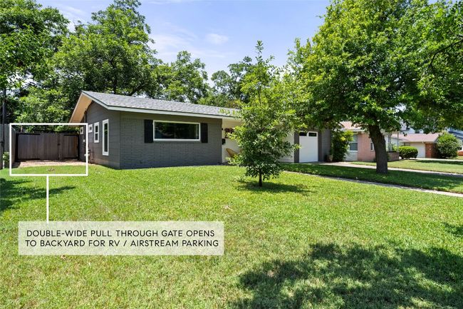 View of front of home and side gate to pull Airstream or boat to rear! | Image 25