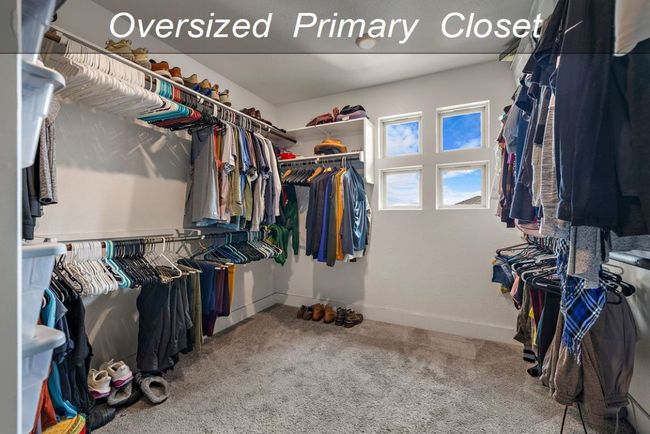 Spacious closet with carpet floors | Image 13