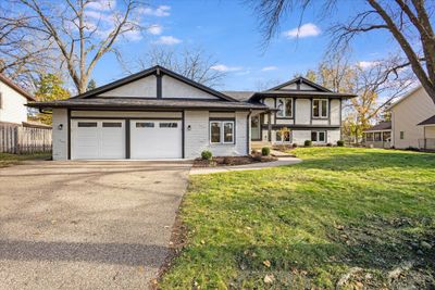 Double doors on the garage, New Roof, New Windows, freshly painted exterior | Image 2