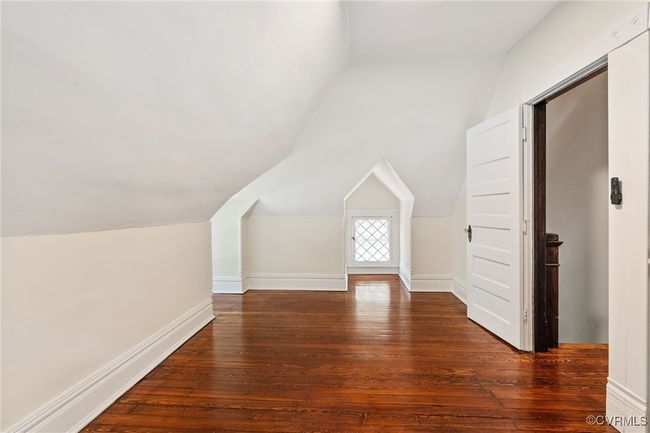Bedroom featuring lofted ceiling and hardwood floors | Image 45