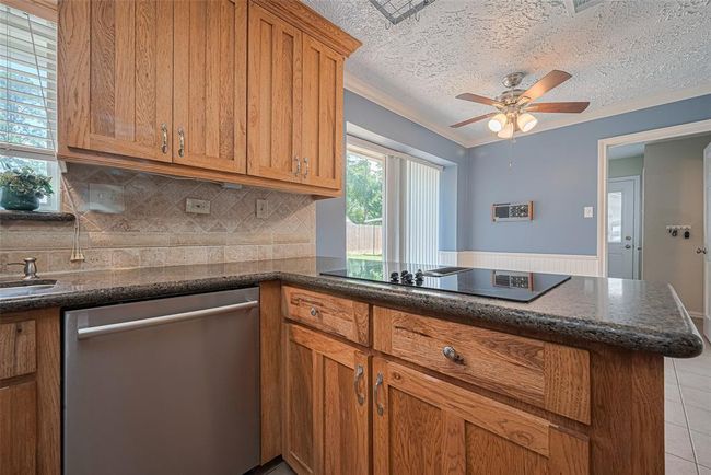 These gorgeous cabinets are custom and handmade. Beautiful wood finish. | Image 9