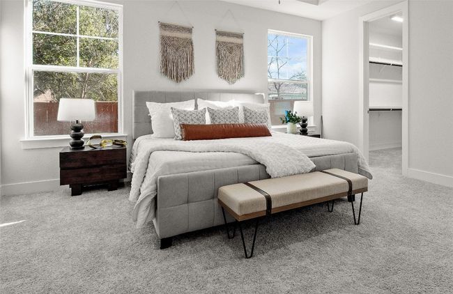 Carpeted bedroom with a walk in closet, a closet, and baseboards | Image 17