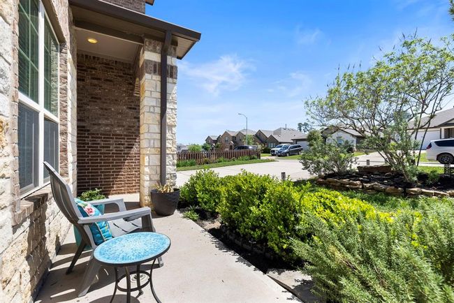 Adorable front porch perfect for enjoying morning coffee or evening cocktails. | Image 4