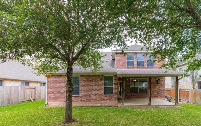 Back of property with a patio, brick siding, and a shingled roof | Image 29