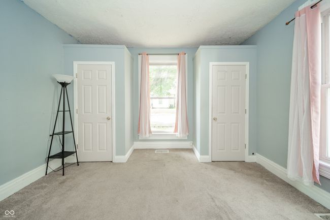 unfurnished bedroom with carpet floors and a textured ceiling | Image 22