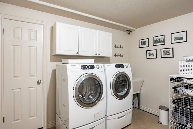 Full bathroom with toilet, vanity, and shower / tub combo with curtain | Image 29