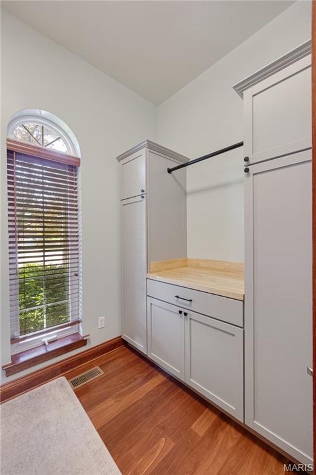Spacious closet with light wood-type flooring | Image 45
