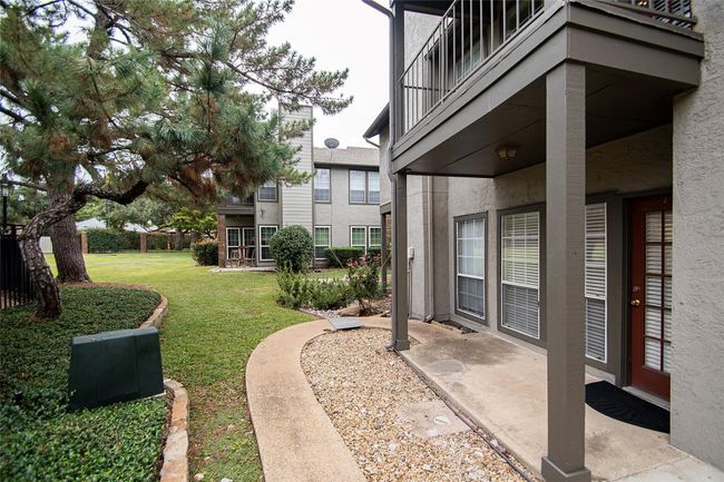 View to covered patio and grassy area | Image 11