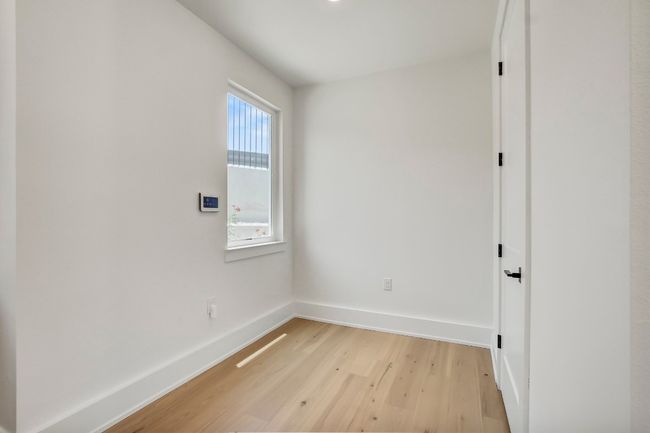 Spare room featuring light wood-style floors and baseboards | Image 13