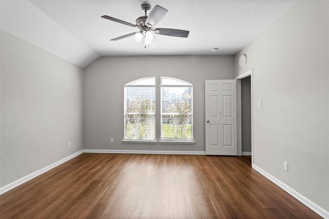 The Primary Bedroom has very nice large windows and beautiful flooring. | Image 11