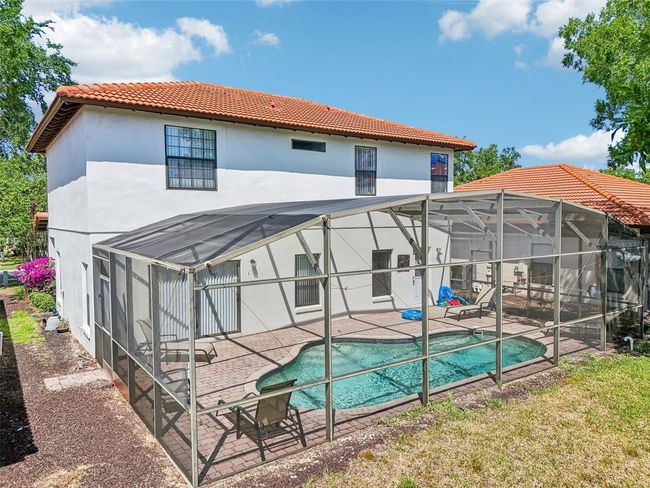 Screened-in Pool View from Back Yard | Image 37