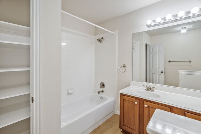 Full bathroom with vanity, and shower / bath combination | Image 20