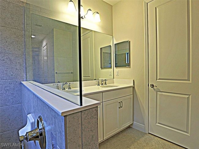 Full bathroom with vanity and tile patterned floors | Image 17