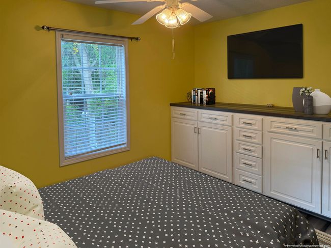 Bedroom featuring carpet floors and ceiling fan | Image 11