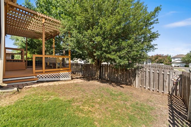 View of yard with a wooden deck and a pergola | Image 35