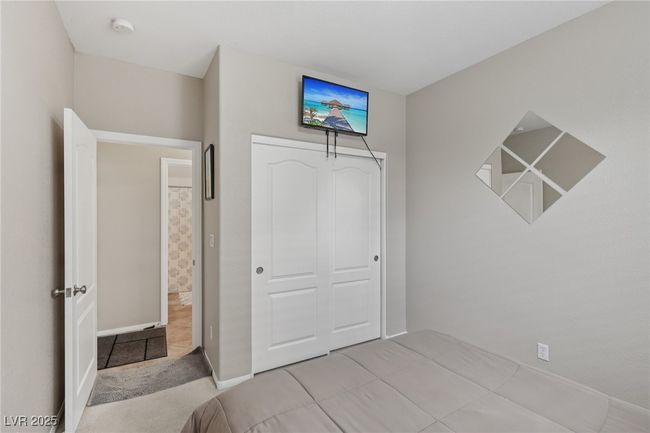 Unfurnished bedroom featuring a closet and baseboards | Image 33