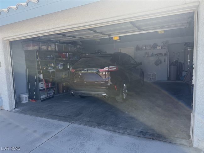Garage featuring a garage door opener | Image 73