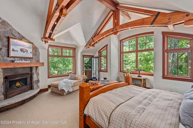 Featuring vaulted ceilings, beautiful truss work, gas fireplace and sunny afternoon deck from which to enjoy the river. | Image 29