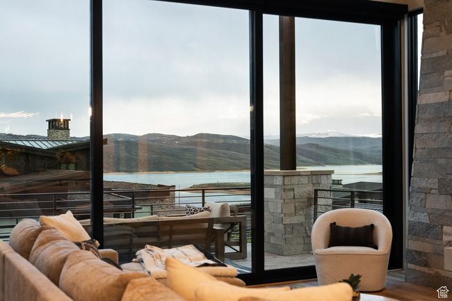 Interior space with outdoor lounge area and a water and mountain view | Image 16