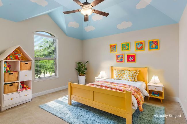Bedroom with vaulted ceiling, carpet, baseboards, and a ceiling fan | Image 9