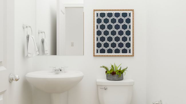 Bathroom featuring sink and toilet | Image 6